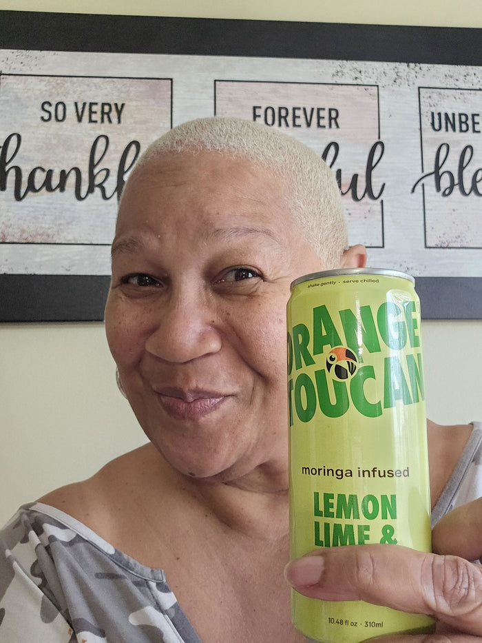 Tamiko U. holding a can of Lemon, Lime & Mango