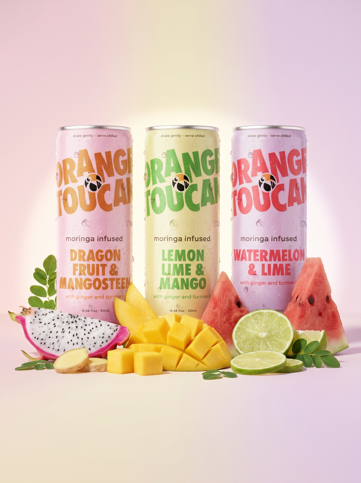 Three Orange Toucan cans with dragon fruit, mango, watermelon and lime
