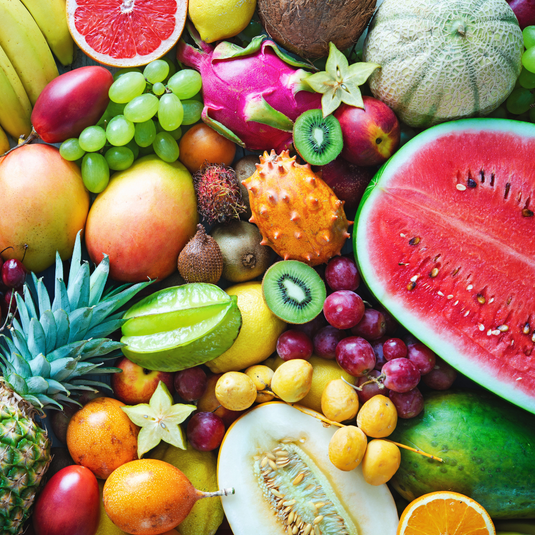 Assorted fruits including watermelon, kiwi, grapefruit, grapes, and pineapple.